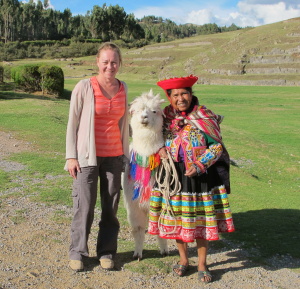 Sally Watson with llama and Peruvian woman